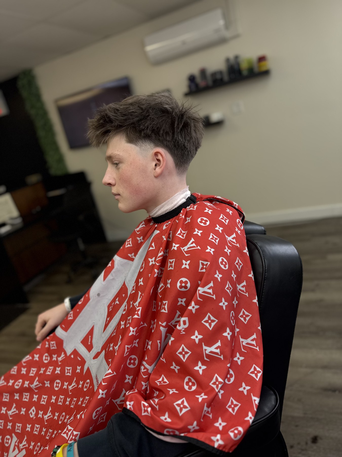 Mid taper fade with textured fringe